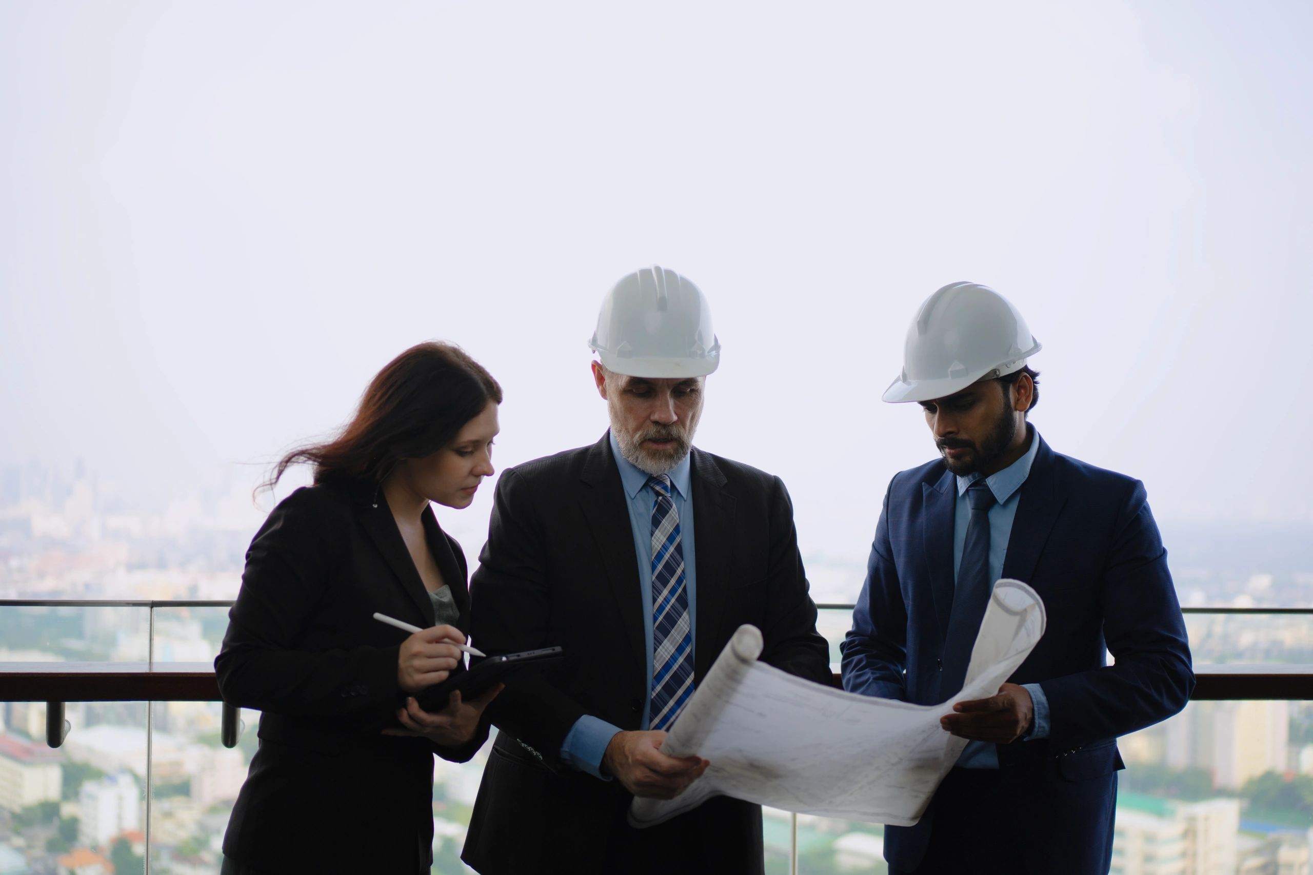 Engineering professionals in a construction-related workspace